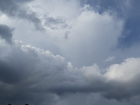 Towering Storm Clouds Against a Blue Summer Sky