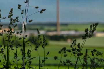 Obraz premium Big industry factory with green fields near Dacice town in summer evening