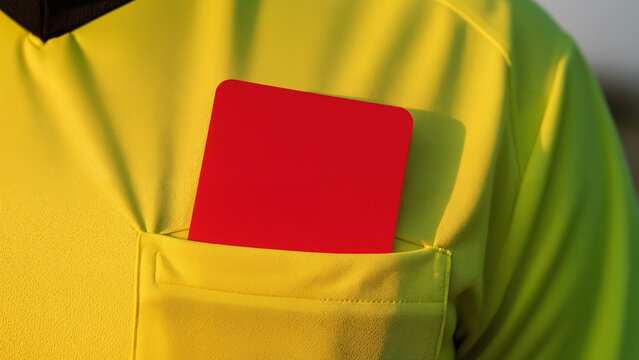 Close Up Red Card Emerging From Referee Uniform Pocket