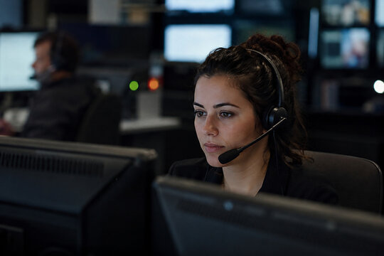 Emergency hotline operator working calmly in generic support center