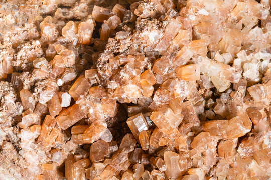 surface of crystalline brown aragonite rock