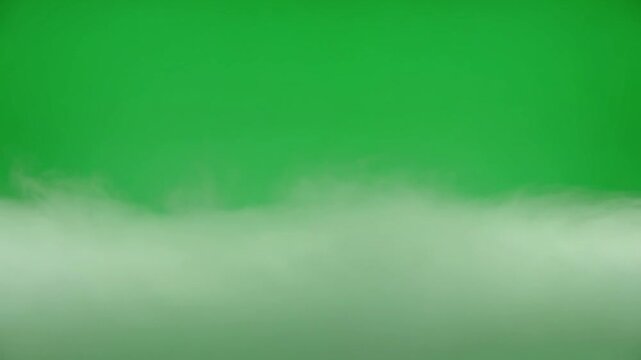 Thick rolling white mist or low clouds against a green screen fog smoke fog