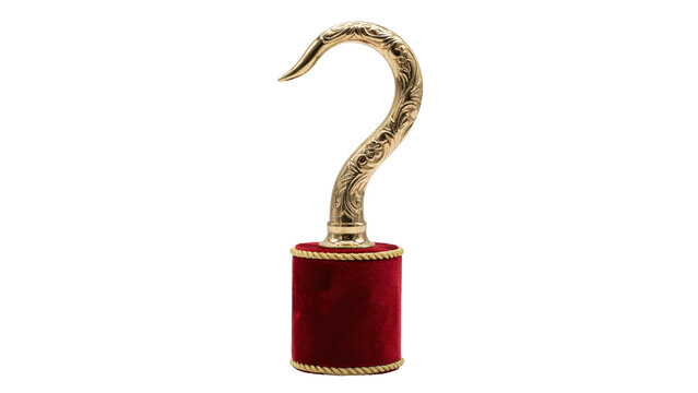 A decorative pirate hook prop featuring a polished gold metal hook with intricate engravings, set on a cylindrical red velvet base