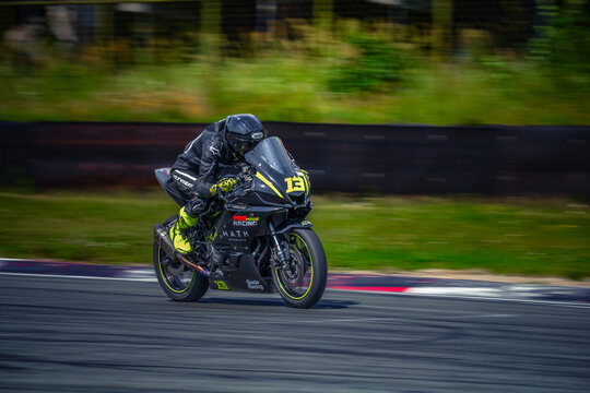 Regular training in Riga, Latvia, Bikernieki on 12-05-2026  Motorcyclist leaning into a turn on a race track