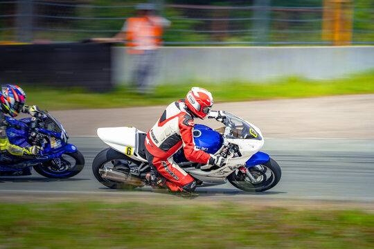 Regular training in Riga, Latvia, Bikernieki on 12-05-2026  Motorcycle racer leaning into a turn on a race track