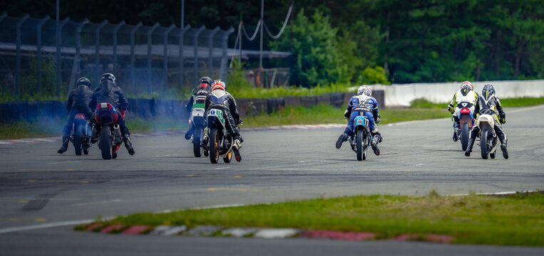 Regular training in Riga, Latvia, Bikernieki on 12-05-2026  Motorcycle racers leaning into a corner on a racetrack