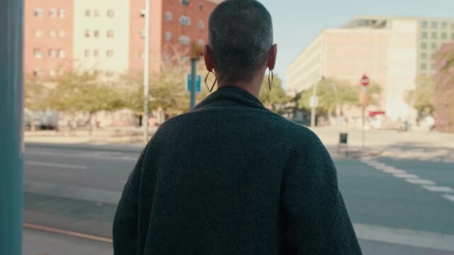 Confident Woman With Short Hair Turns On City Street