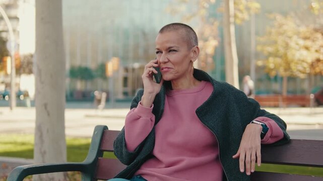 Cheerful Woman With Short Hair Enjoying A Mobile Phone Call