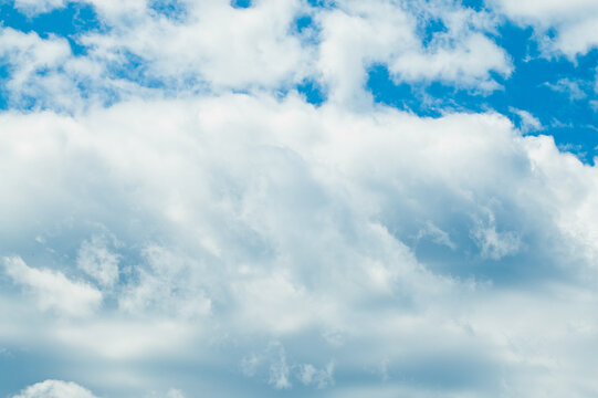 The photo shows a blue sky and clouds