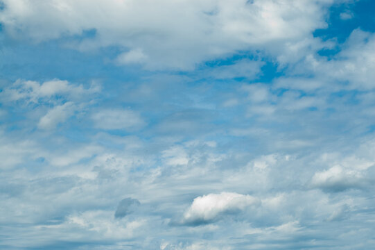The photo shows a blue sky and clouds