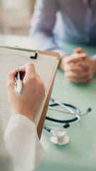 Fototapeta premium Doctor filling out the anamnesis form