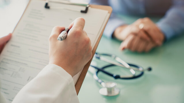 Doctor filling out the anamnesis form