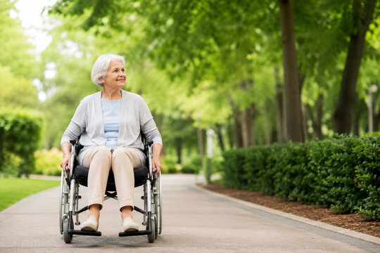 Senior Woman Using Wheelchair on Accessible Path