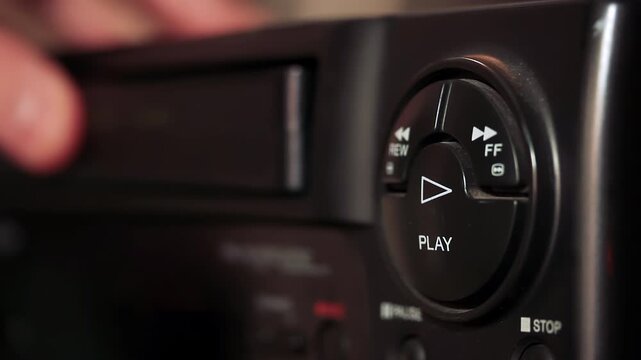 Vintage VCR Cassette Insertion and Playback Close Up Action - 4K