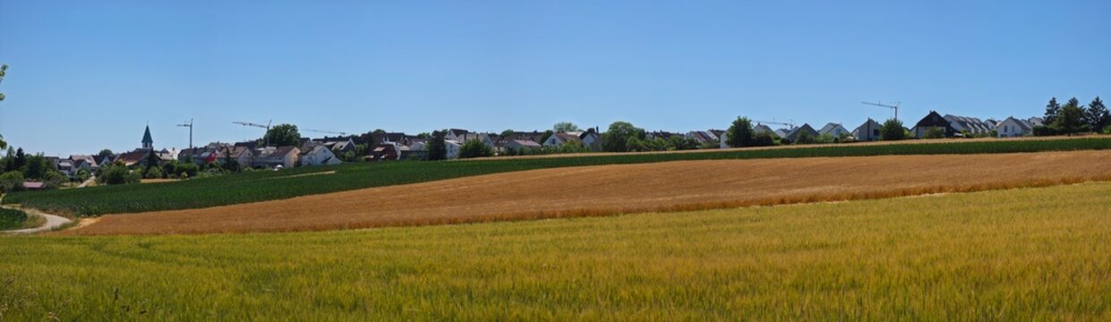 germany, spectacular wide panoramic colorful farmland surrounding ostfildern kemnat with growing skyline and cranes under brilliant summer sunshine