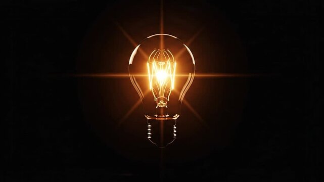 Glowing incandescent light bulb on black background