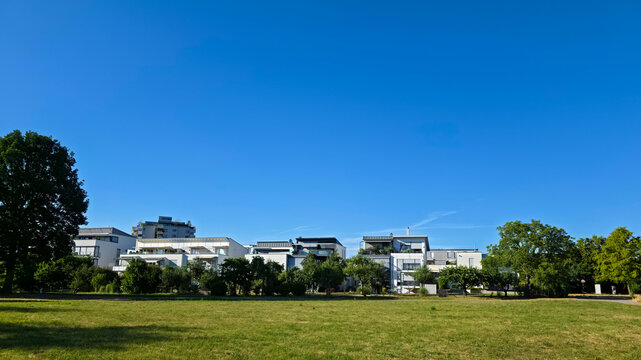 germany, beautiful panoramic green meadows surrounding ostfildern ruit residential skyline beneath glowing summer sunshine and endless blue sky