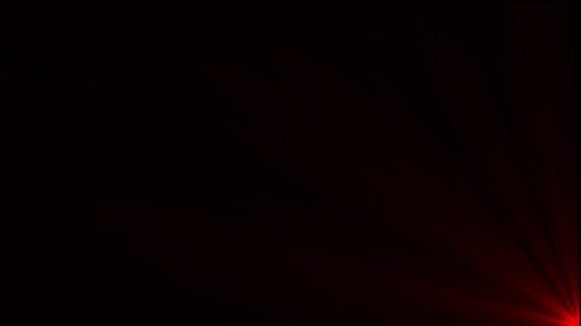 Intense red light flare emanating from the bottom right corner against a solid black background creating a soft glowing ray effect for overlays
