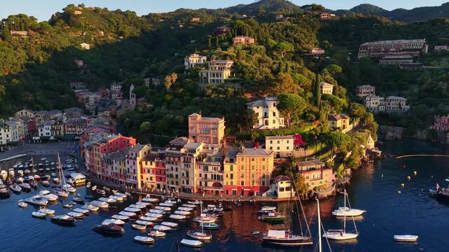 Charming Italian resort of Portofino in Liguria, Mediterranean coast of Italy, drone sunrise view of Portofino in Italy, vacation and luxury holiday destination in Italy