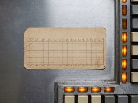 Blank vintage ledger card on brushed steel retro computer panel