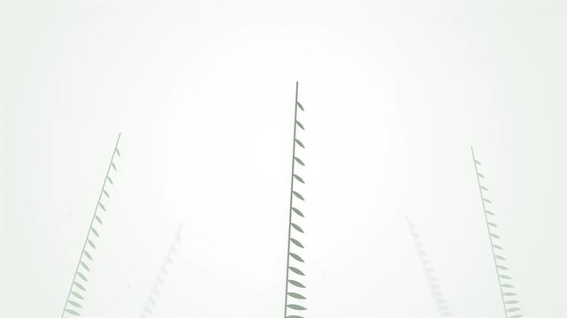 Abstract view of power lines against a bright white sky.