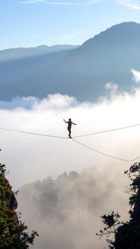 Slackline Over Clouds.