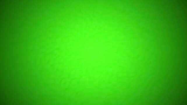 Vibrant green liquid surface texture abstract background, with soft ripples, and light reflections