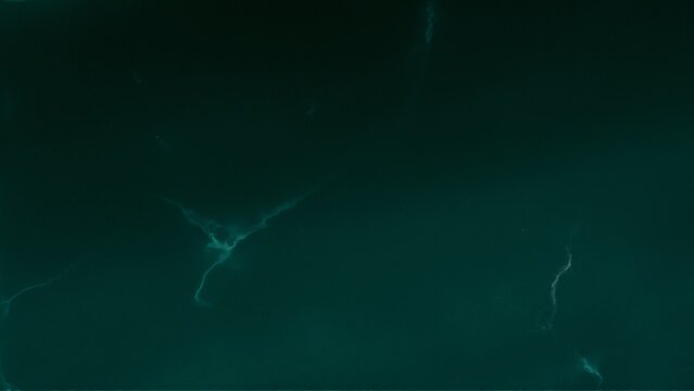 Deep green malachite gemstone texture abstract background