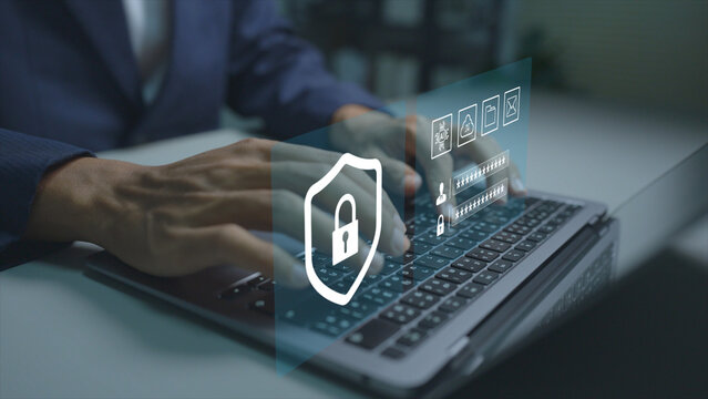 AI cybersecurity concept. Person using laptop with artificial intelligence and cybersecurity icons, intelligent threat detection, network protection, data security and cyber defense.