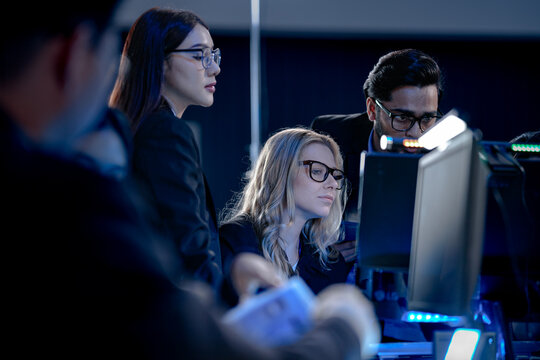 Building tomorrow AI tonight deep focus diverse engineers code train complex models multi screen setup innovation lab intense collaboration future tech taking shape now project crunch.