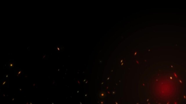 Dynamic cinematic fire sparks fly upward from intense glowing red embers on black background