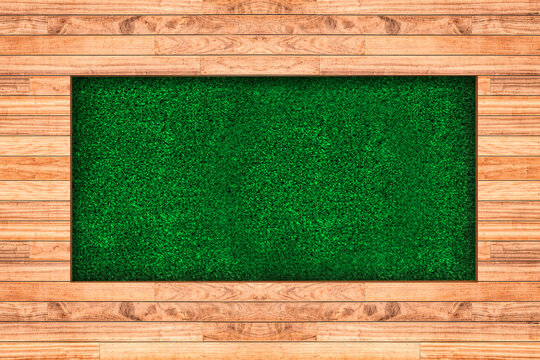 Wood and artificial light green grass background. 