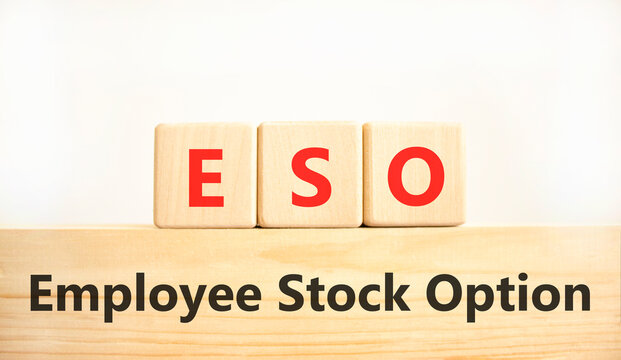 ESO employee stock option symbol. Concept words ESO employee stock option on beautiful wooden blocks. Beautiful white background. Business ESO employee stock option concept. Copy space.