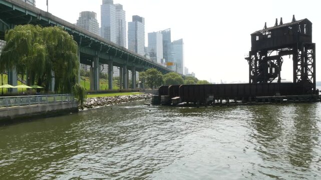 New York City Riverside Park South Manhattan United States. Modern residential building Upper West Side. Urban skyscraper skyline. Miller highway remnant, elevated viaduct. Industrial gantry dock pier