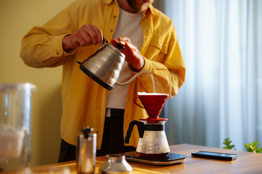 Man Pouring Coffee With Gooseneck Kettle 