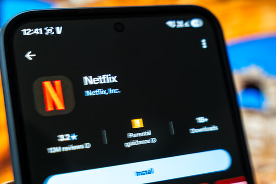 Warsaw, Poland - July 6, 2026: Close-up of a smartphone displaying the Netflix application icon with installation options visible on screen
