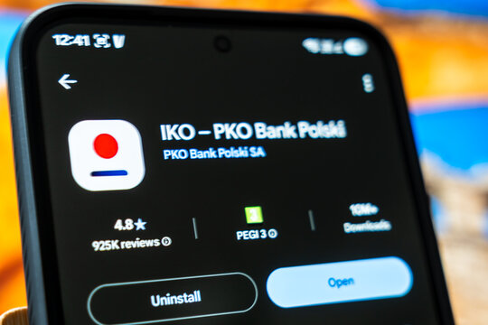 Warsaw, Poland - July 6, 2026: Mobile phone displaying the IKO app of PKO Bank Polski with high ratings and review details, highlighting the trend of banking technology in contemporary financial serv