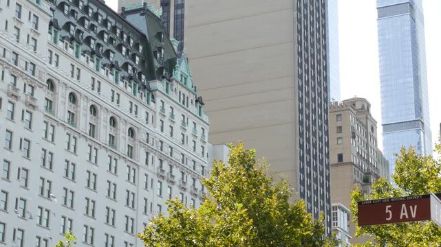 New York City Manhattan Midtown, United States. Old historic hotel building 1907 on Grand Army Plaza, 5 fifth avenue sign near Central Park. Classic iconic american architecture. Pulitzer Plaza in NYC