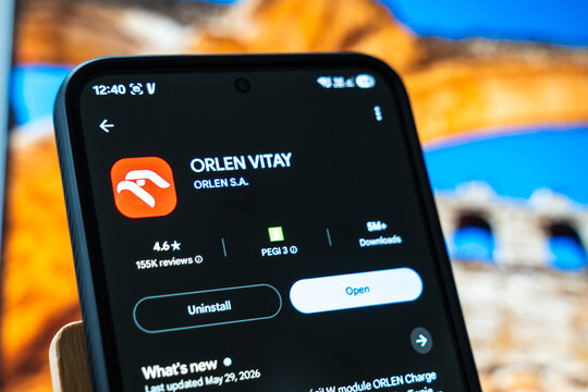 Warsaw, Poland - July 6, 2026: Close-up of smartphone screen displaying ORLEN VITAY app interface with ratings and download information on colorful background