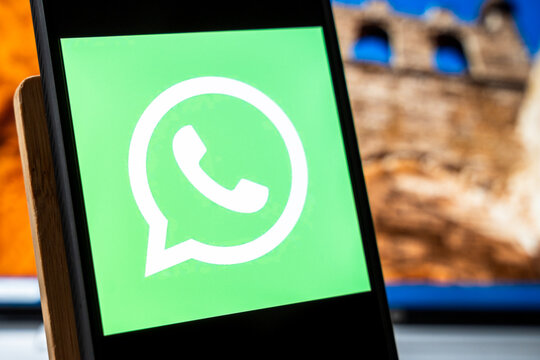 Warsaw, Poland - July 6, 2026: Close-up view of a smartphone displaying WhatsApp logo against a blurred background, symbolizing communication and social media interaction in modern life.