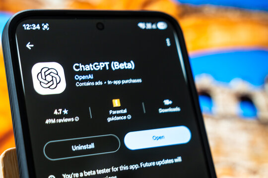 Warsaw, Poland - July 6, 2026: A close-up view of ChatGPT app interface on a smartphone, showcasing its beta version and user ratings, with a colorful backdrop adding to the tech atmosphere.