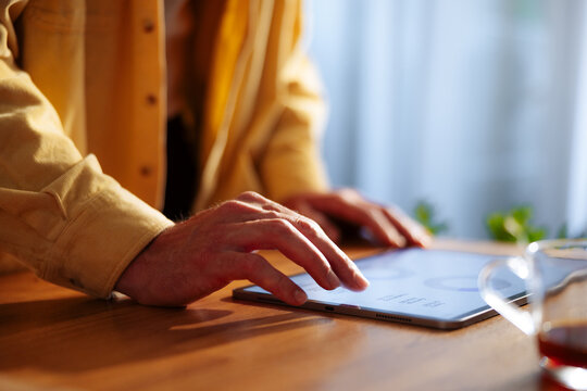 Hands Using Tablet Touchscreen for Remote Work and Productivity