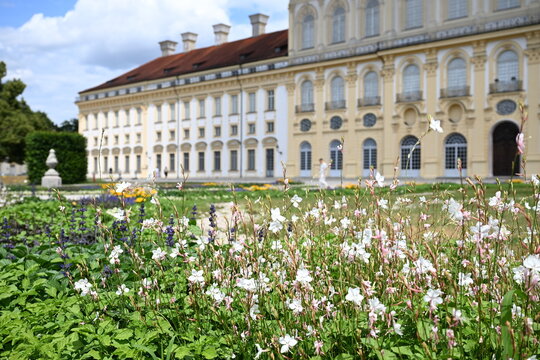 Flowerbed in front of a historic palace facade