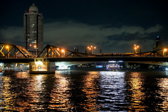 Ninety-plus years old and it's still the busiest crossing on the river, the Chao Phraya River of Bangkok in Thailand
This is Memorial Bridge , Phra Phuttha Yodfa, over the Chao Phraya River in Bangkok