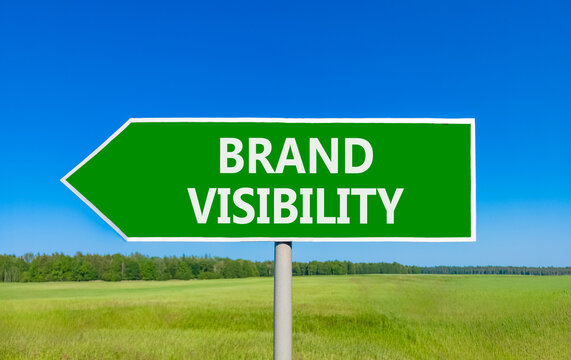 Brand visibility symbol. Concept words Brand visibility on beautiful green road sign. Beautiful blue sky green grass field background. Business branding and brand visibility concept. Copy space.