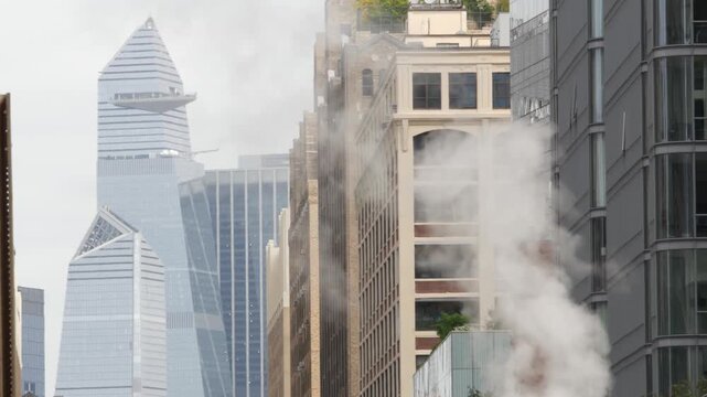 New York City Manhattan Midtown Hudson Yards district towers, United States of America. Urban skyscraper building, modern architecture in Chelsea. Cityscape from Varick street. Hot steam, vapor smoke.