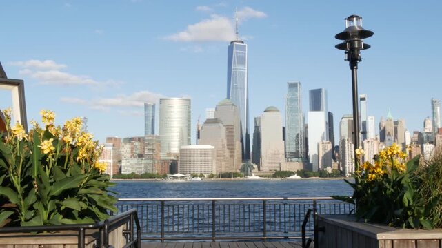 New York City Manhattan downtown financial district skyline, New Jersey Exchange Place, United States. Urban cityscape with skyscraper buildings, World Trade Center. J Owen Grundy park, Paulus Hook.