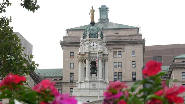 New York City Brooklyn Downtown civic center, United States of America. Borough Hall, municipal administration government historic old building 1846. City hall architecture. Autumn fall flowers bloom.