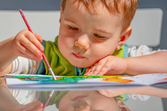 Focused child expressing creativity during an educational art lesson.