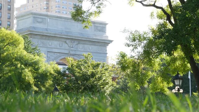New York City Manhattan Washington Square Park arch, United States. Marble historic monument Greenwich Village. 5 fifth avenue triumphal arch. Autumn fall garden greenery. George Washington memorial.
